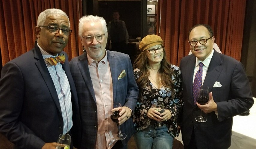 Julian shares a glass of wine with Shawn Jeffers, Executive Director of Little Cities, along with former Cubs manager Joe Madden and his wife