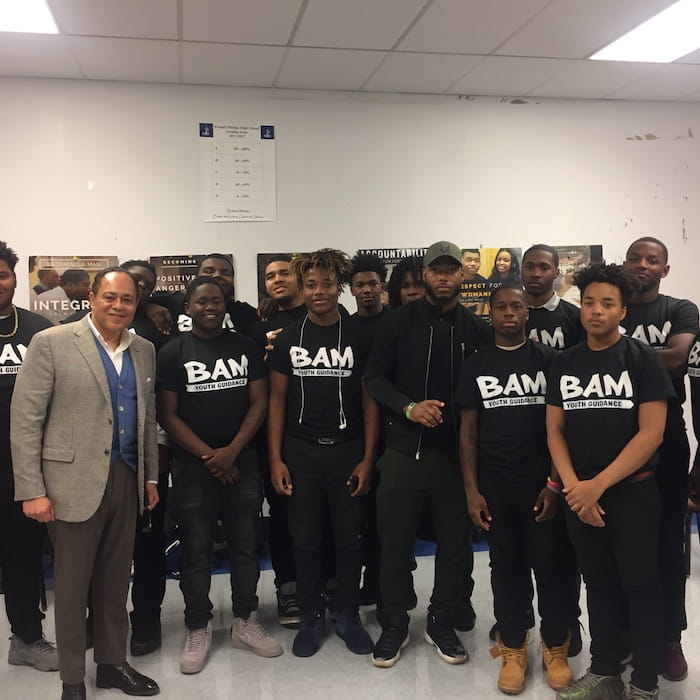Julian and NFL Safety Adrian Amos (Bears, Packers) share a moment with participants of Chicago-based youth anti-violence program Becoming a Man (BAM)