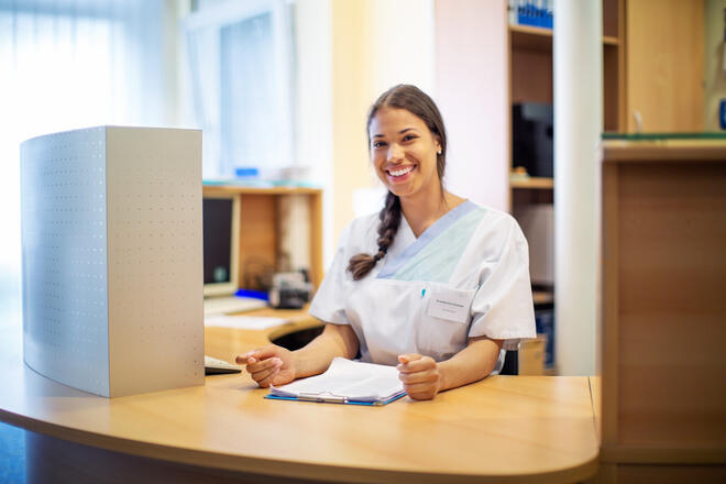 healthcare worker on a computer