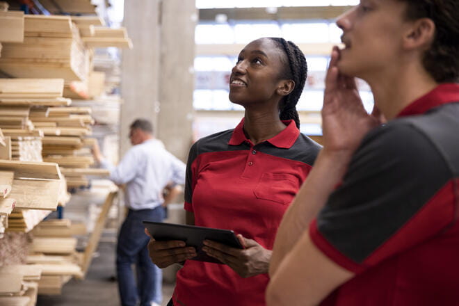 a few people talking in a library