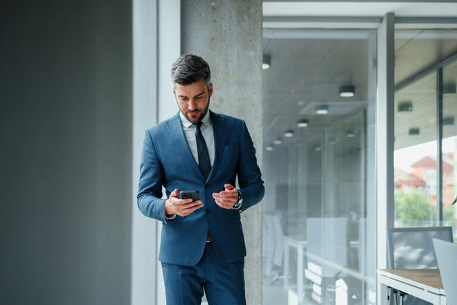 man looking at report