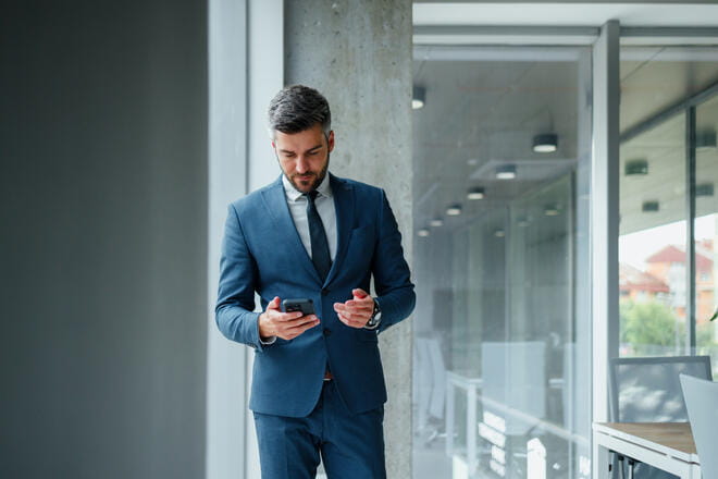 man looking at report
