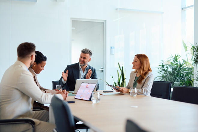 a group of people sitting around a table