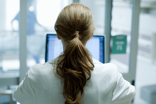 woman staring at a computer