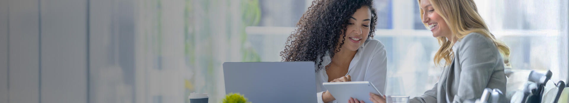 Business colleagues having a conversation in a board room.
