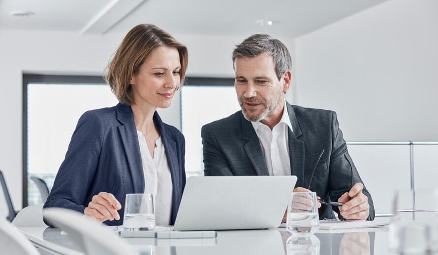 Business leaders conducting a mid-year financial review.