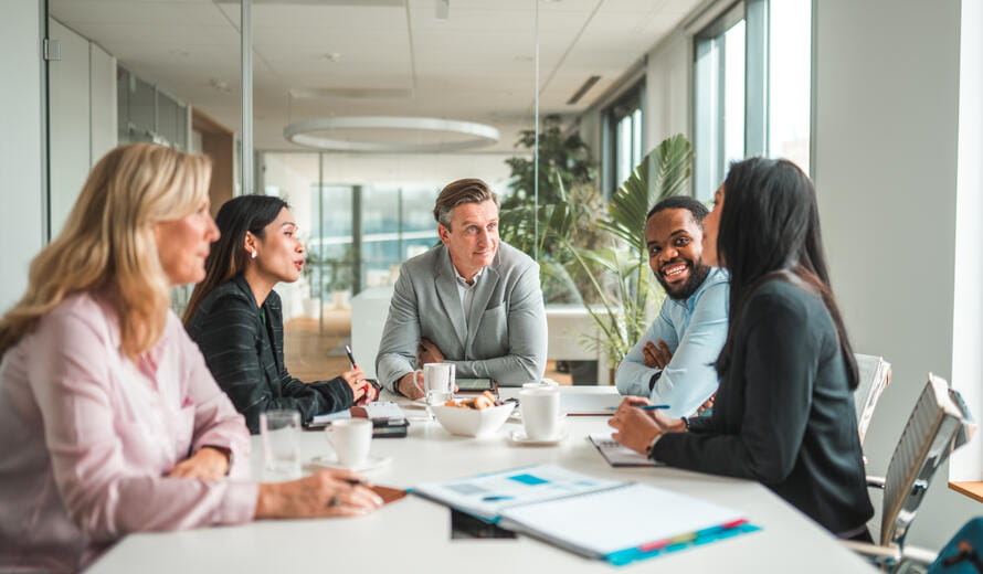 Multi-ethnic team sitting in a meeting room