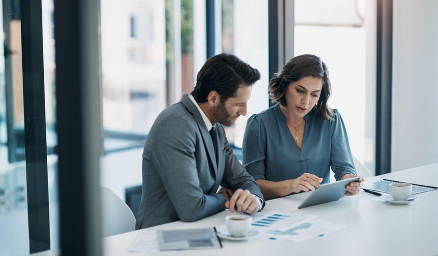Image of business people discussing financial plans.