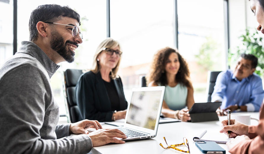 Stock photograph depicting a professional team meeting in an office environment.