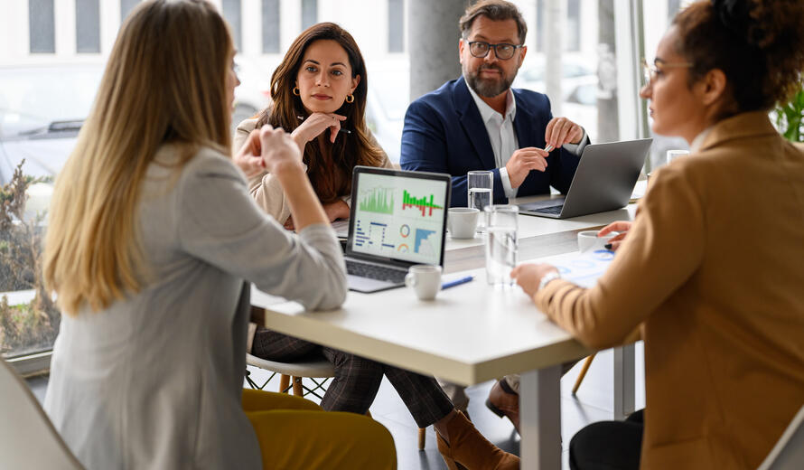 Professionals discussing business performance metrics.