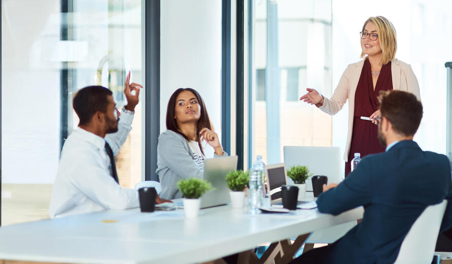 a group of people sitting around a table