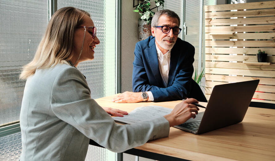 A financial advisor meeting with clients