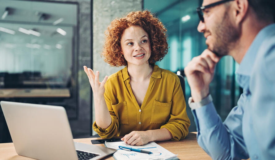 Couple of business persons talking in the office