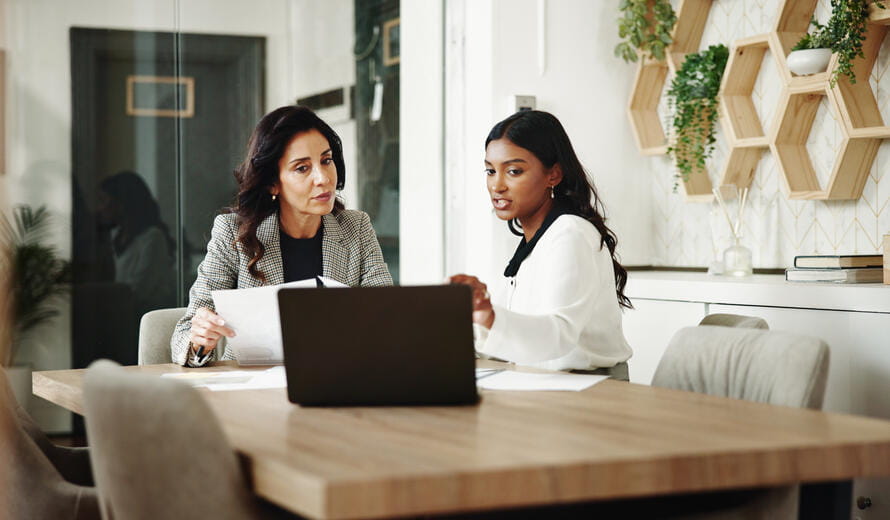 Office, women and business people with laptop for meeting, investment project and discussion. Teamwork, accountant and financial advisor with feedback for finance update, report review and documents