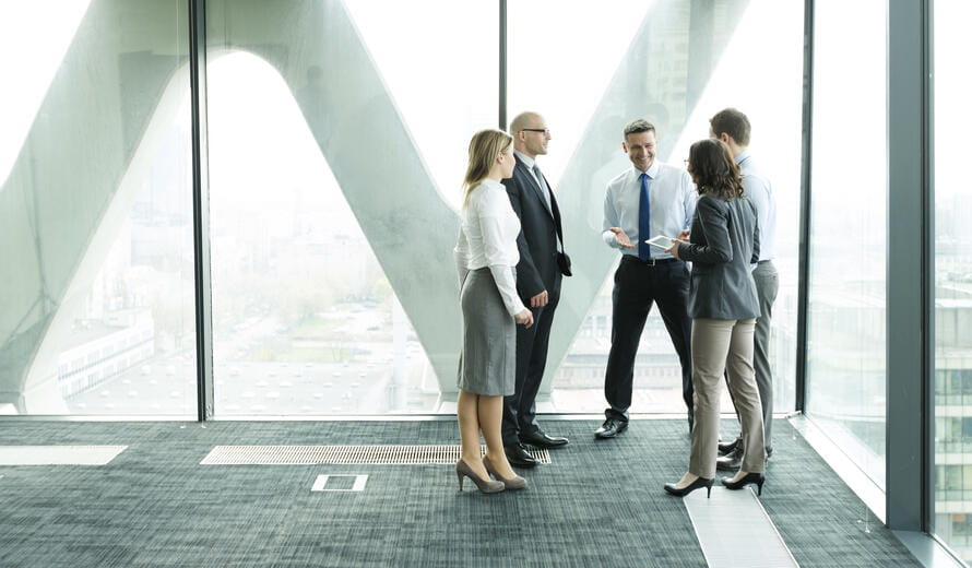 a group of people standing in a hallway