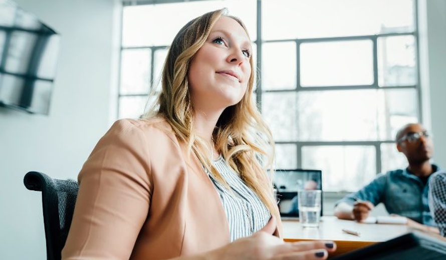 Businesswoman listening in meeting