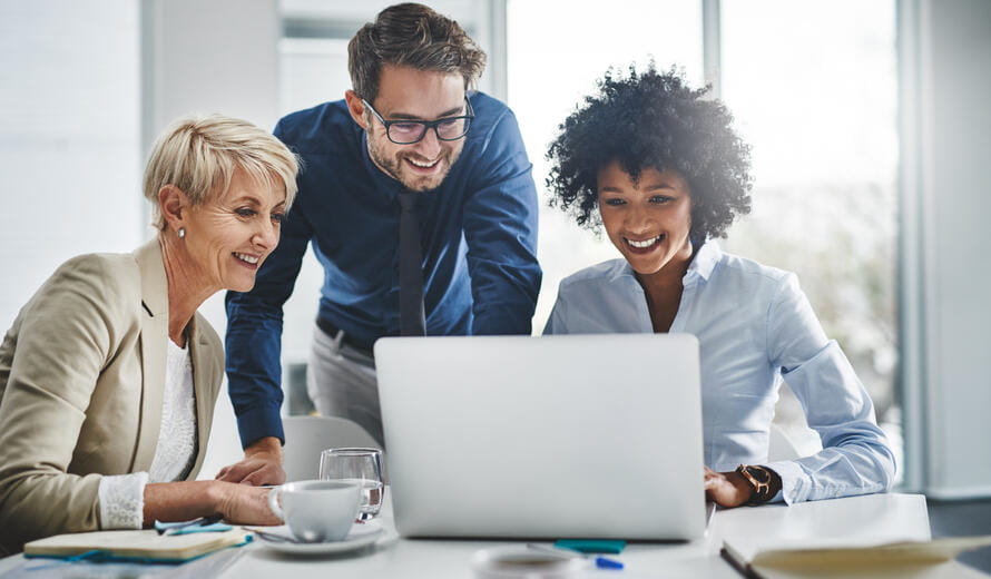 Shot of a group of businesspeople working together on a laptop