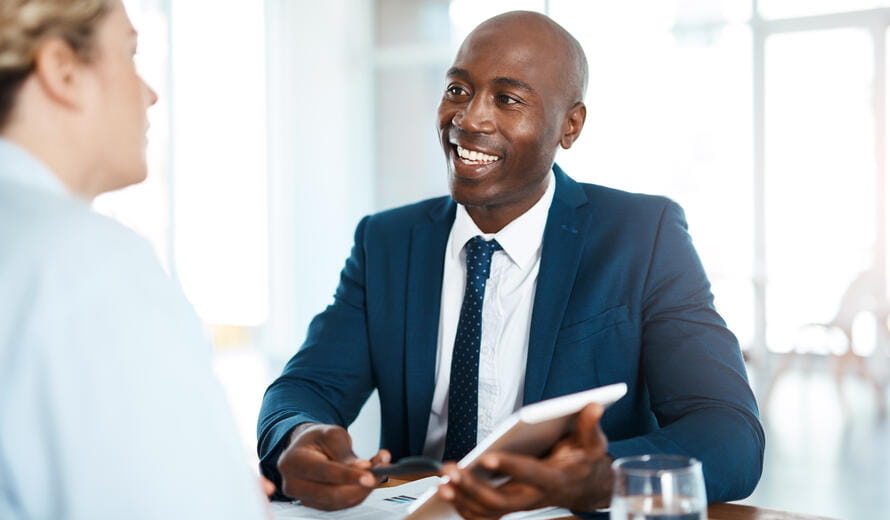 Shot of a young businessman and businesswoman having a discussion in a modern office