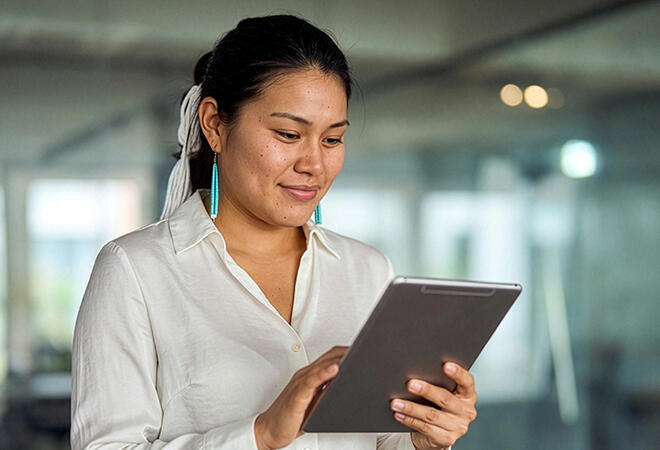 woman looking at a tablet