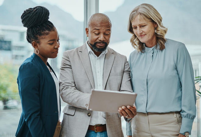 people looking at a tablet