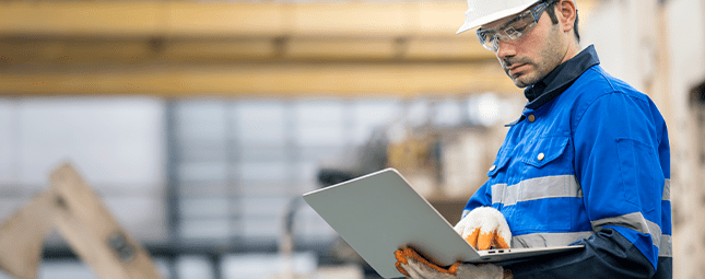 construction man on a laptop