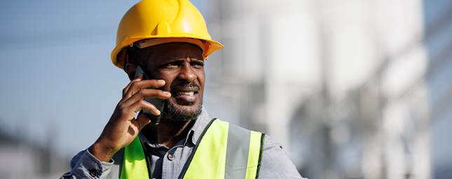 construction worker on the phone